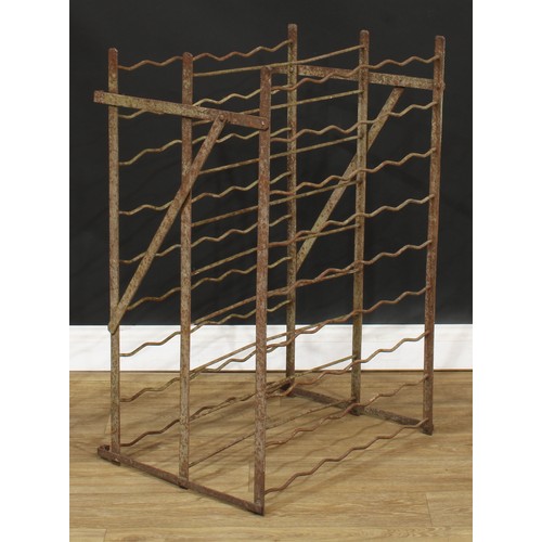 319 - A French wrought iron oenophilist’s double-sided wine rack, 90.5cm high, 59cm wide, 47.5cm deep