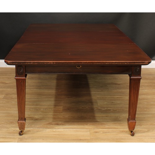 420 - A late Victorian mahogany extending dining table, rounded rectangular top with two additional leaves... 