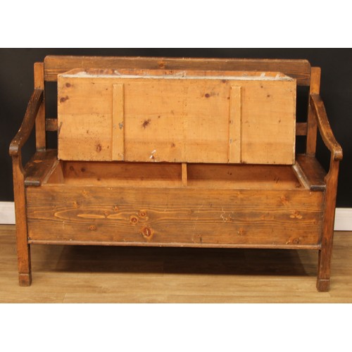 693 - A pine box settle or bench, removable seat, formerly hinged, 93.5cm high, 134.5cm wide, the seat pan... 