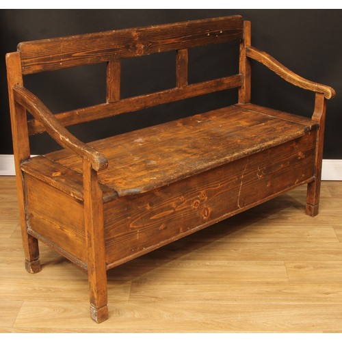 693 - A pine box settle or bench, removable seat, formerly hinged, 93.5cm high, 134.5cm wide, the seat pan... 