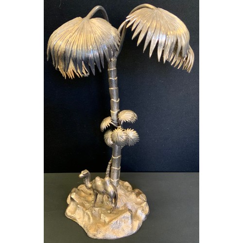 148 - A Victorian plated table centrepiece, as a camel, standing below a palm tree, 44cm high, unmarked