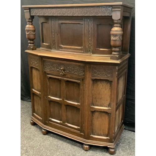 153 - A mid 20th century oak Court Cupboard, single small cupboard door to top, above a short drawer and l... 