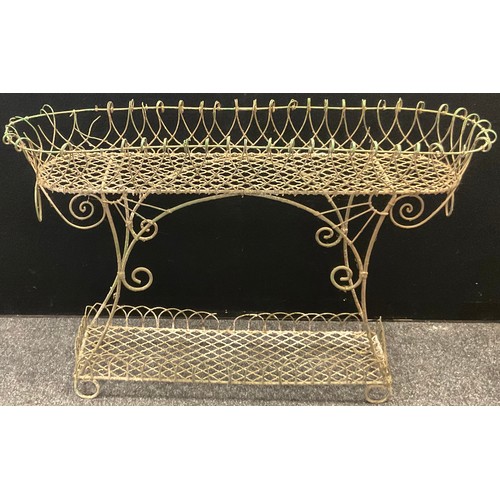 164 - An early 20th century oval wirework plantstand, shaped under tier, 73cm high, 118cm long, 28cm wide