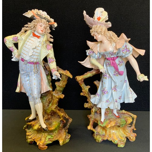 177 - A pair of late 19th century German figures, of a gallant and companion, in 18th century dress, 33cm ... 