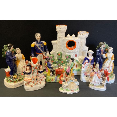 182 - A Staffordshire castle tower watch stand;  others reproduction, pair of Sailors Farewell bookends;  ... 