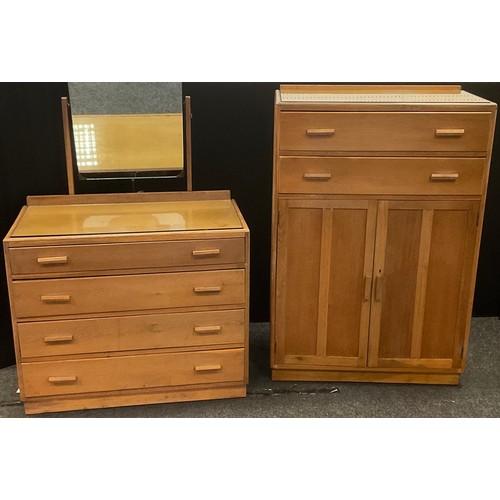 192 - A golden oak tallboy, two long drawers over two doors, 123cm high, 83cm wide, 48cm deep;  dressing t... 