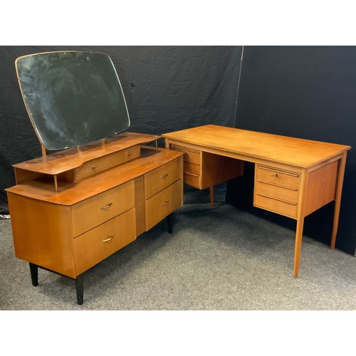 195 - A retro 1960s Advance furniture dressing table, shaped mirror back above open shelf and an arrangeme... 