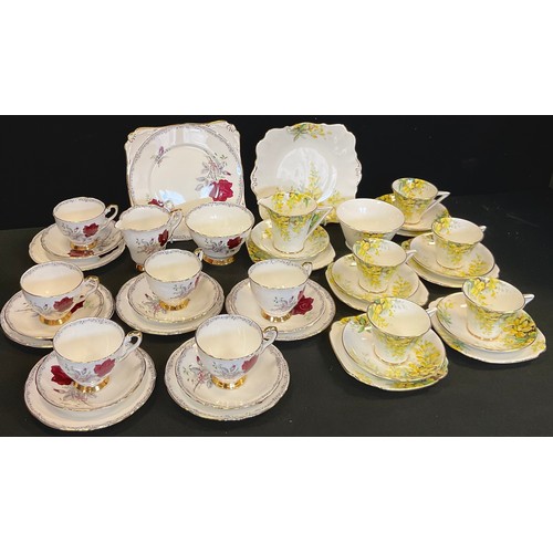 204 - A Royal Stafford Laburnum pattern tea set, for five;  another Roses to Remember part set, for four.