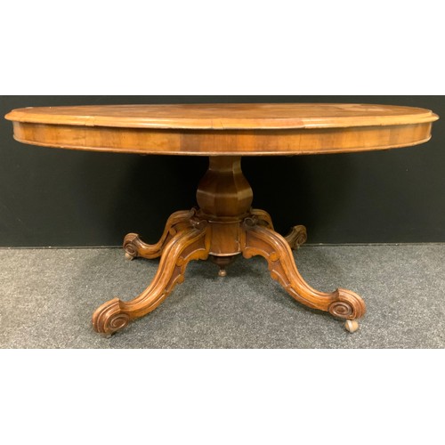 212 - A Victorian walnut oval loo table, c.1870

panelled baluster column, scroll legs

75cm high
141cm wi... 