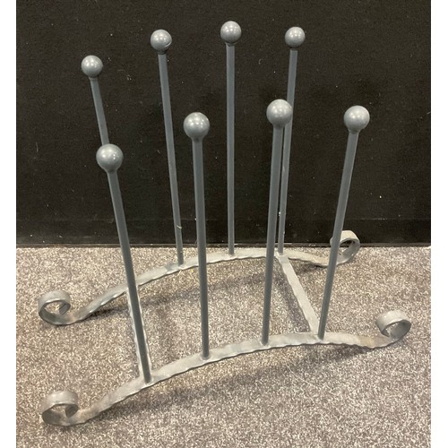 213 - A cast/wrought iron four pair boot rack, 61cm high, 71cm long