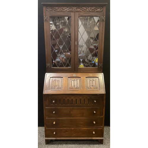 224 - A set Jaycee oak linen fold bureau bookcase