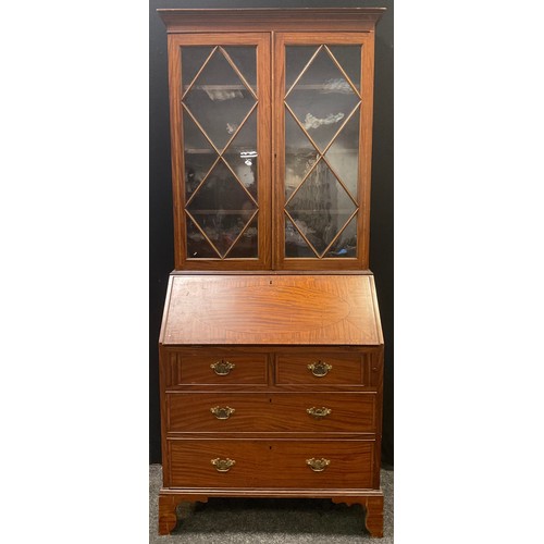 235 - A 19th century satinwood bureau bookcase, the interior with shell patera, 203cm high, 84cm wide