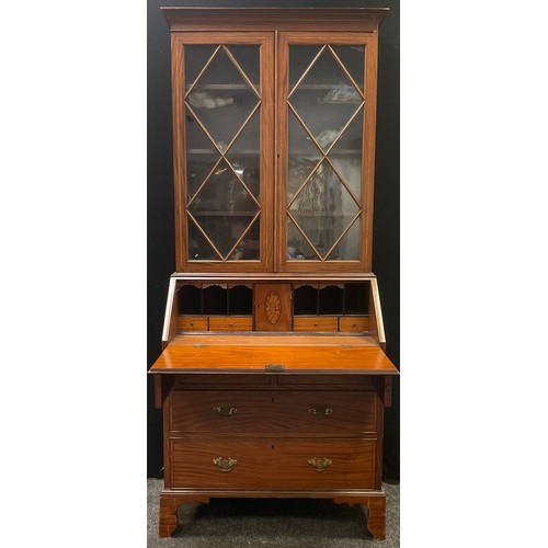 235 - A 19th century satinwood bureau bookcase, the interior with shell patera, 203cm high, 84cm wide