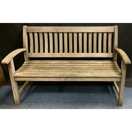 245 - A modern slatted garden bench, 93cm high, 138cm long, 62cm deep