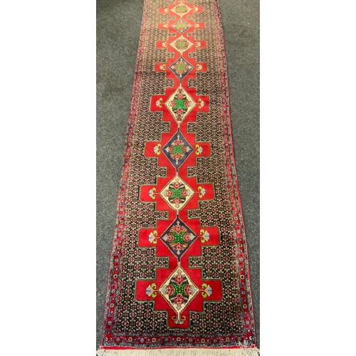 248 - A Fine Persian hand-made Senneh runner carpet, 382cm x 92cm.