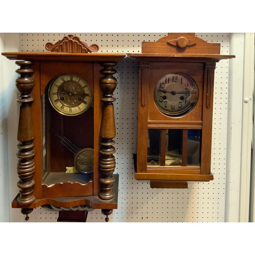 249 - An early 20th century walnut vienna wall clock, brass dial;  another (2)