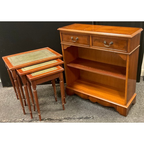 268 - A reproduction walnut bookcase, fitted with two cockbeaded drawers, 79cm high, 76cm wide;  a nest of... 