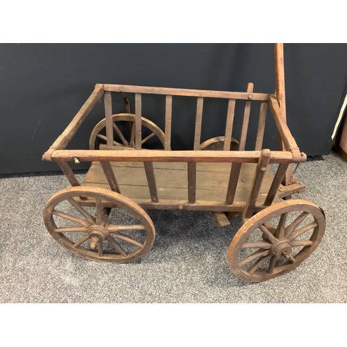 291 - A late 19th/early 20th century hand cart, hinged handle, metal bound wheels, 64cm high, 64cm wide, 1... 