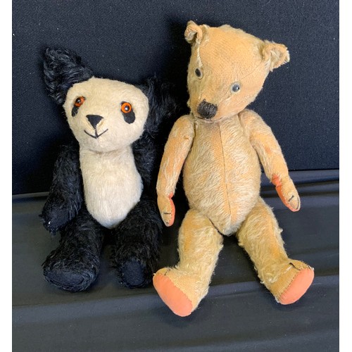 346 - An early 20th century jointed teddy bear, 39cm high, c.1940;  another, panda, 32cm high (2)