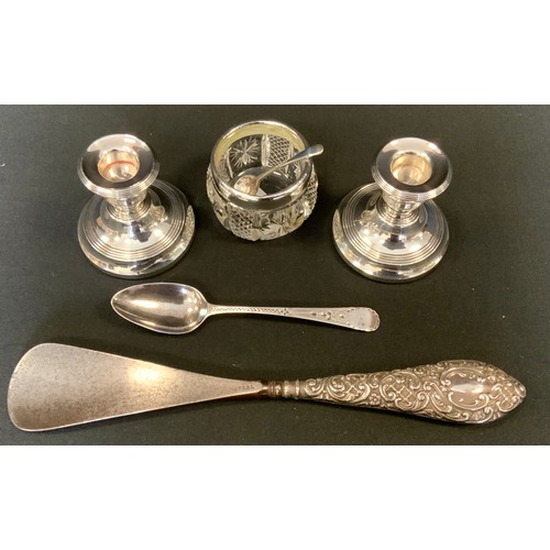 362 - Silver - a pair of weighted candlesticks;  George III silver tea spoon;  silver hafted shoe horn etc... 