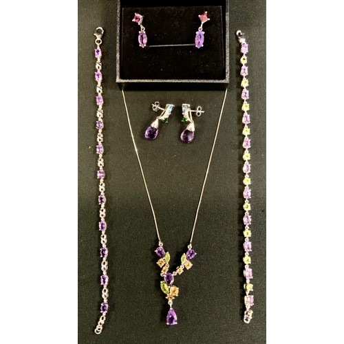 387 - A silver multi gem pendant necklace set with peridot, amethyst, citrine etc' similar earrings, brace... 