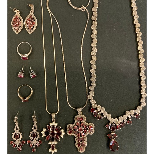 395 - An Art Deco style garnet and marcasite necklace, 925 silver mounts;  similar pendant earrings, cross... 