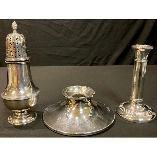 67 - A silver sugar sifter, Birmingham 1930; a silver candlestick, Birmingham 1911; a silver inkwell, lac... 