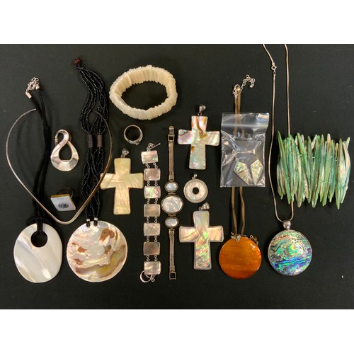 428 - A silver and mother of pearl bracelet;  another;  abalone necklace;  cross pendant;  bracelets, earr... 