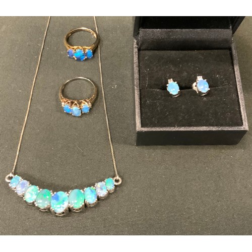 397 - A 925 silver mounted blue opal doublet swag necklace and earrings suite, stamped 925;  two similar d... 