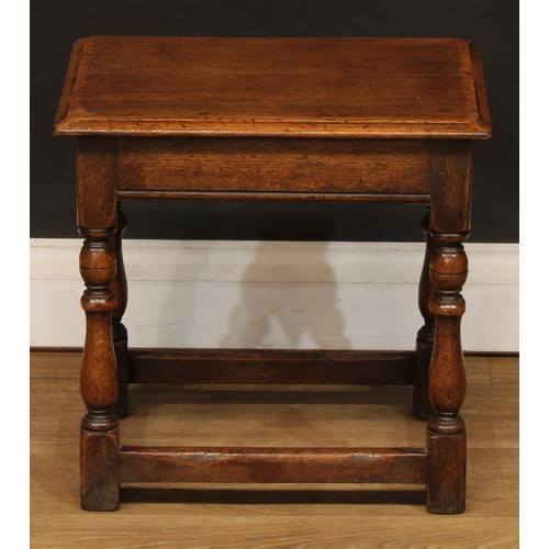 667 - An 18th century style oak joint stool, 39cm high, 40.5cm wide, 30.5cm deep