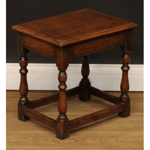 667 - An 18th century style oak joint stool, 39cm high, 40.5cm wide, 30.5cm deep