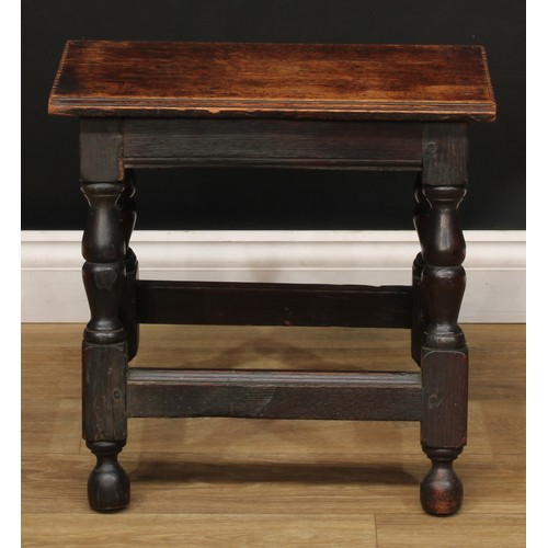 669 - A 19th century oak joint stool, oversailing rectangular top with notched ends, turned legs, moulded ... 