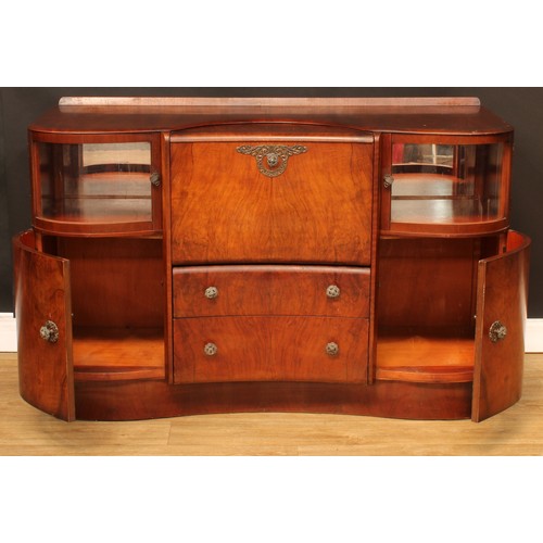 674 - A mid-20th century Art Deco inspired walnut cocktail cabinet, by Beautility, shaped top with shallow... 