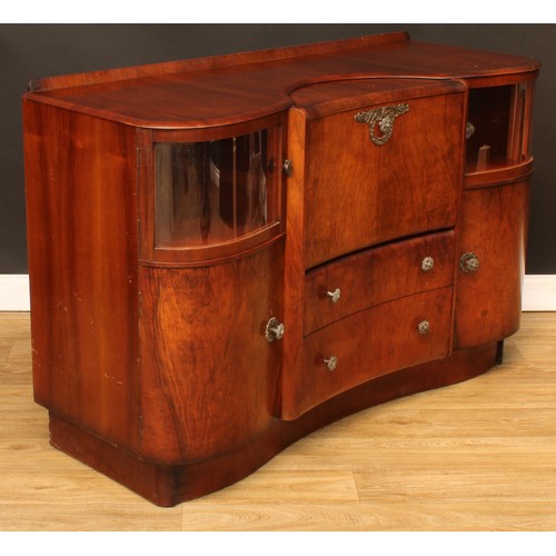 674 - A mid-20th century Art Deco inspired walnut cocktail cabinet, by Beautility, shaped top with shallow... 