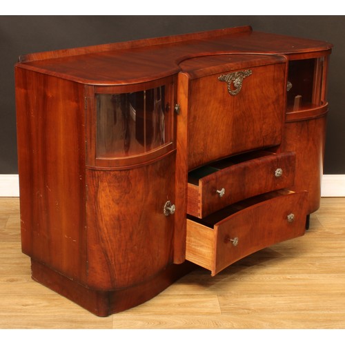 674 - A mid-20th century Art Deco inspired walnut cocktail cabinet, by Beautility, shaped top with shallow... 