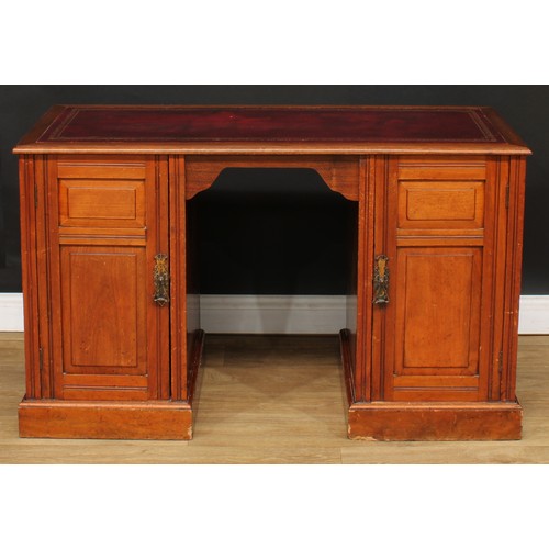 680 - A late Victorian walnut desk, rectangular top with inset tooled and gilt writing surface above a pai... 