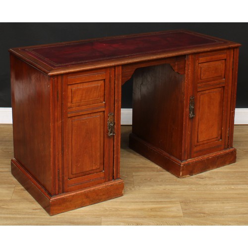 680 - A late Victorian walnut desk, rectangular top with inset tooled and gilt writing surface above a pai... 