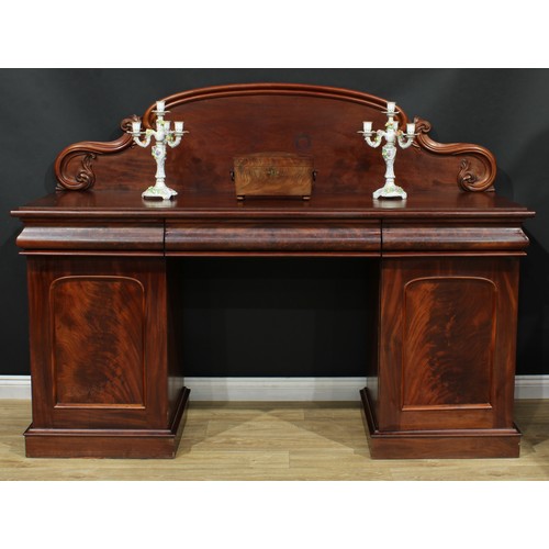 681 - A Victorian mahogany twin-pedestal sideboard, shaped arched back carved with acanthus C and S-scroll... 