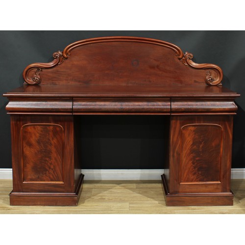 681 - A Victorian mahogany twin-pedestal sideboard, shaped arched back carved with acanthus C and S-scroll... 