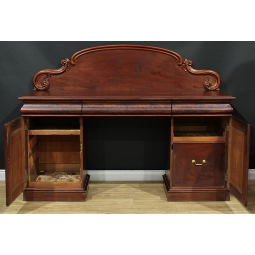 681 - A Victorian mahogany twin-pedestal sideboard, shaped arched back carved with acanthus C and S-scroll... 