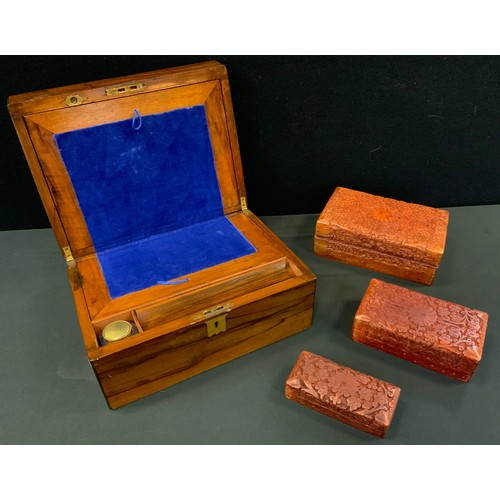 56 - A Victorian mahogany folding writing box, brass shield escutcheon, 30cm wide, c.1860;  other boxes