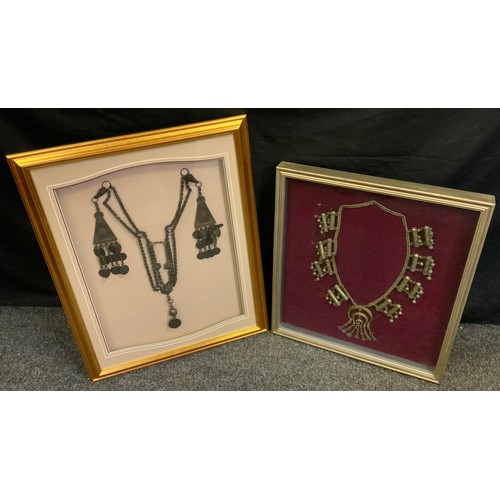 78 - Tribal At - an Egyptian metal necklace, framed;  another (2)