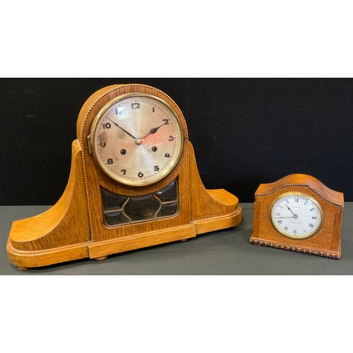 86 - An oak mantel clock, Arabic numerals, twin winding holes, 332cm high, c.1930;  another,. smaller, th... 