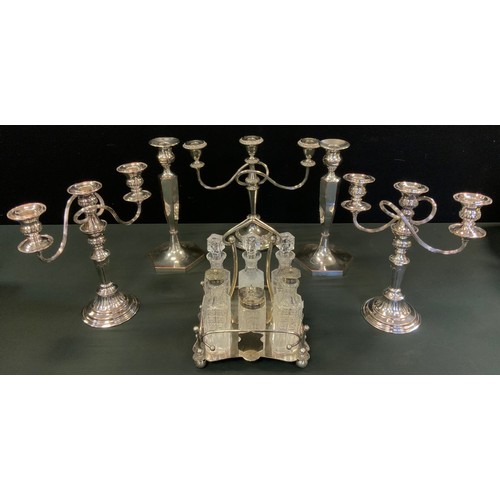 99 - A pair of three light two branch candlesticks, 28cm high;  another;  a pair of Silver on Copper cand... 