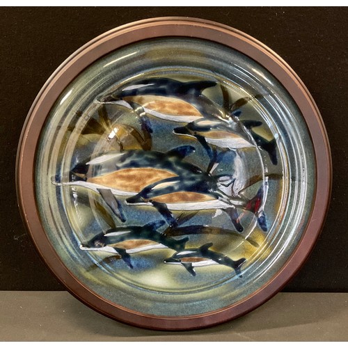 105 - A Cobridge stoneware Ocean Traveller pattern charger designed by Philip Gibson, hand painted with sw... 