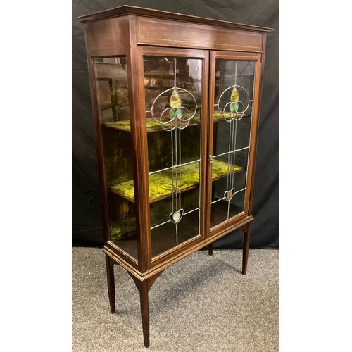 107 - An Edwardian mahogany china cabinet, pair of glazed stained-glass doors enclosing two tiers of shelv... 