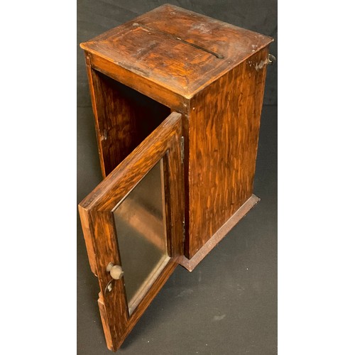 40 - A Victorian oak country house letter box, rectangular top with post aperture, glazed door, 30cm high... 