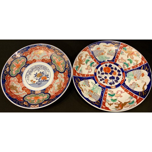 69 - A large Japanese Imari charger, Meiji period, 39.5cm diameter; another similar, 36.5cm diameter (2)