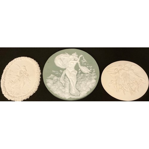 83 - An Art Nouveau green jasperware circular plaque, decorated with scantily clad classical maiden, 17.5... 