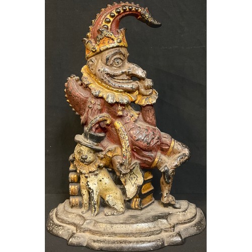 97 - A 19th century cold painted cast iron door stop modelled as Punch with his dog, Toby, 32cm high